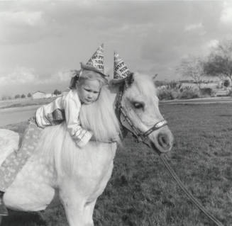 New Year Girl Holding On To Pony