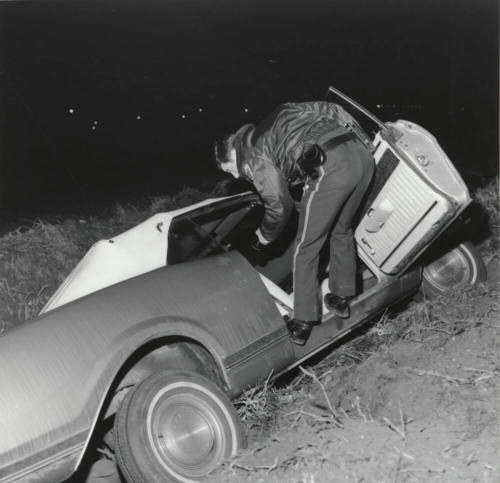 Police Officer and Car on Side