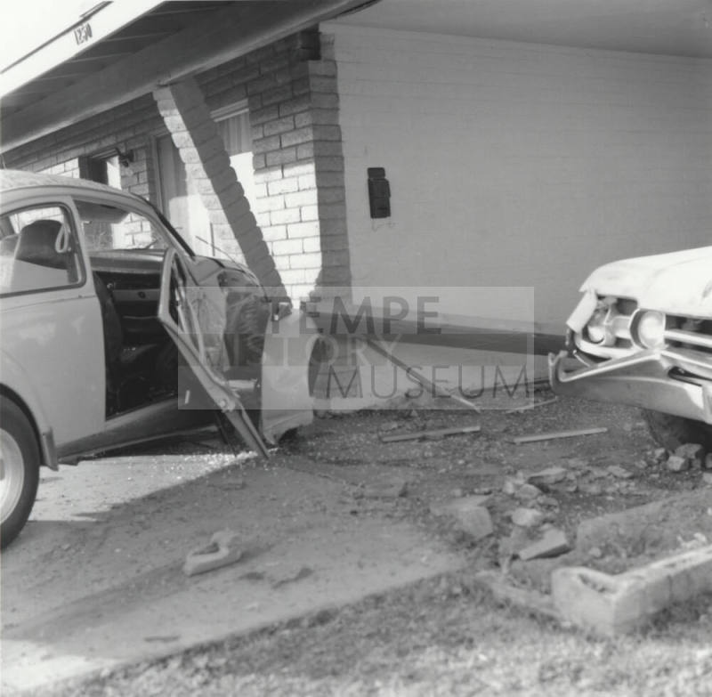 White Car Crashes Into Carport
