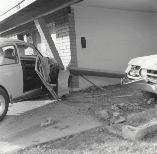 White Car Crashes Into Carport