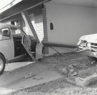 White Car Crashes Into Carport
