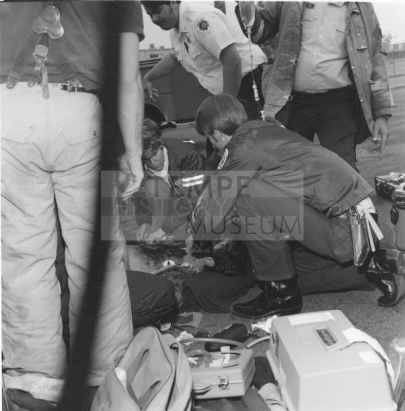 Paramedics Aiding Injured Man