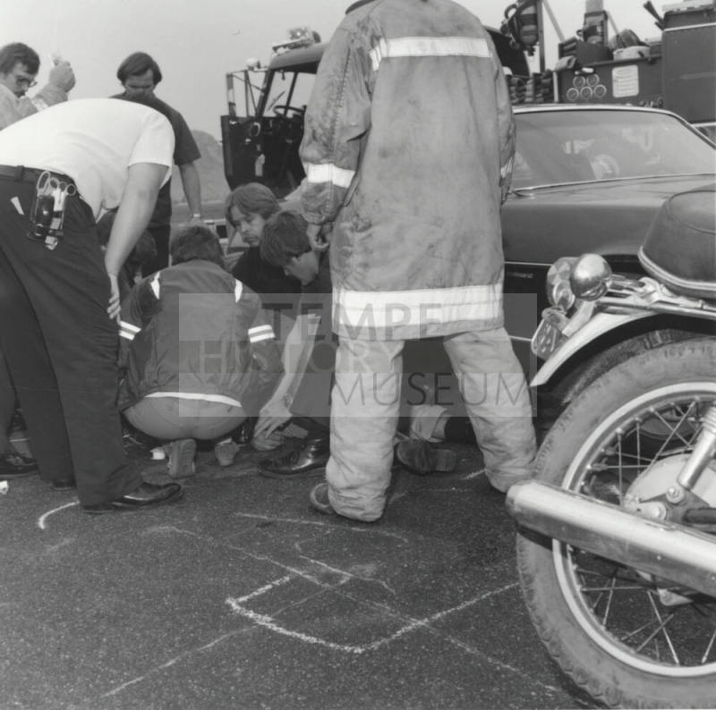 Paramedics Gather Around Injured Man