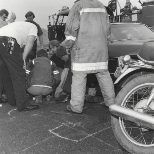 Paramedics Gather Around Injured Man
