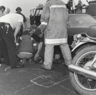 Paramedics Gather Around Injured Man