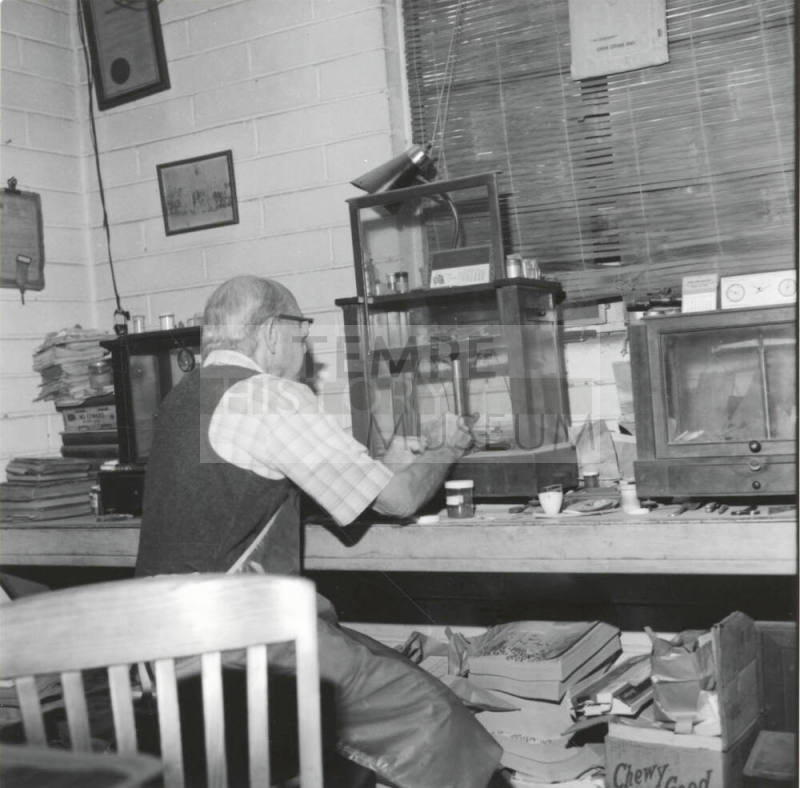 Man at workbench, Jan 1978