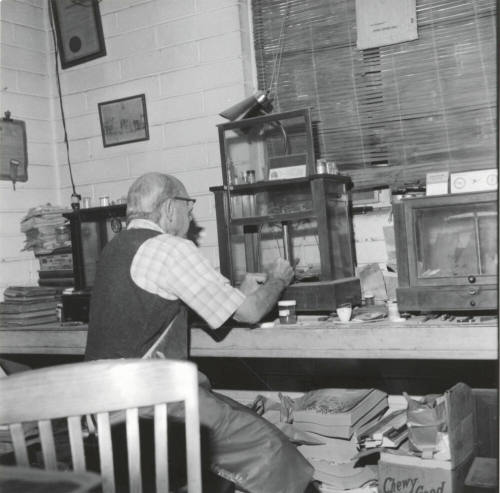 Man at workbench, Jan 1978