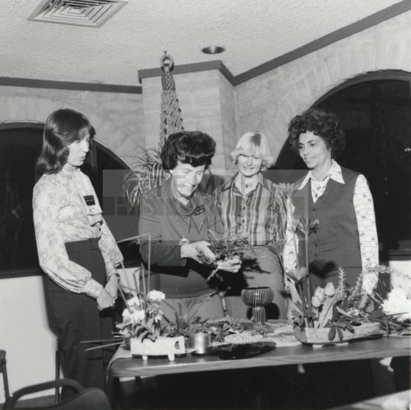 Four women at a table, Jan 1978