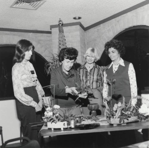 Four women at a table, Jan 1978