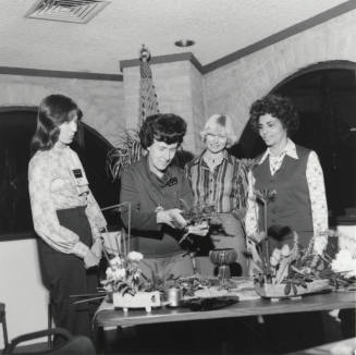 Four women at a table, Jan 1978