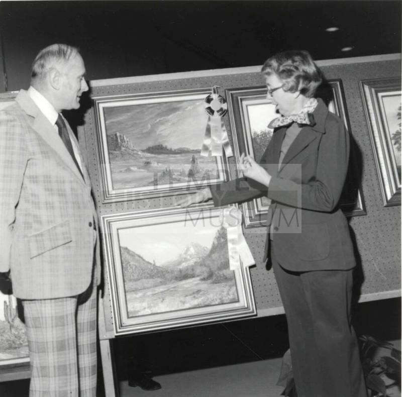 Unidentified Couple Discussing Art