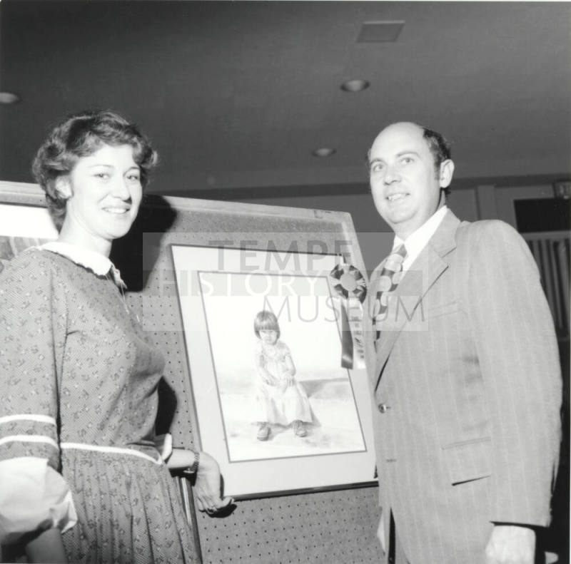 Unidentified Couple Posing With Artwork