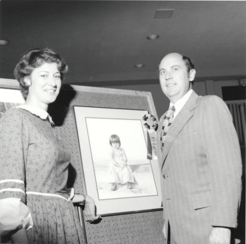 Unidentified Couple Posing With Artwork