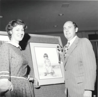 Unidentified Couple Posing With Artwork