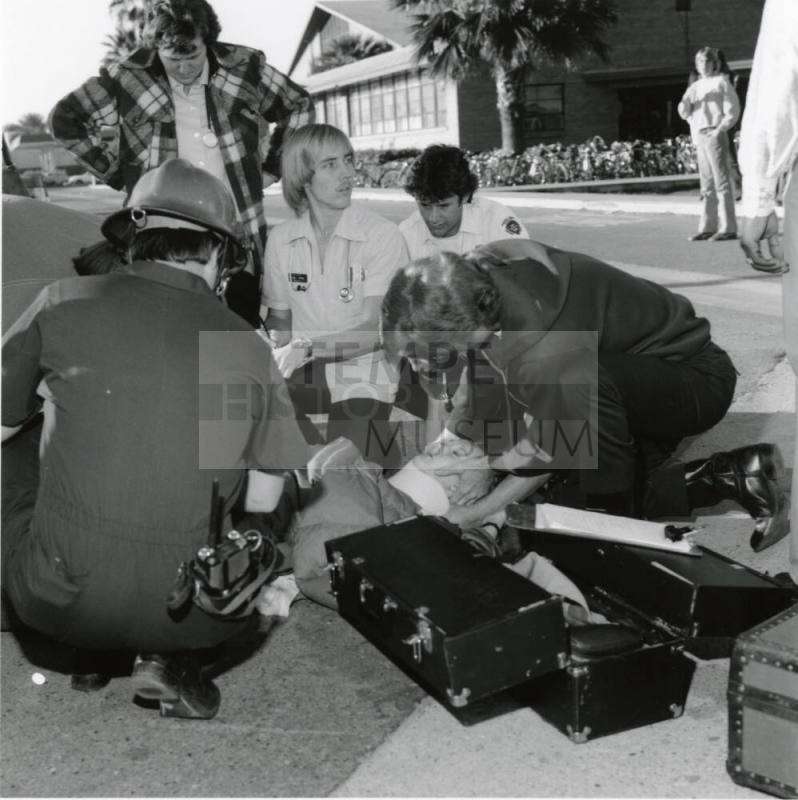 Paramedics assisting a female (1 of 3)