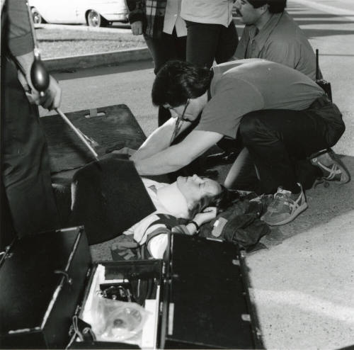 Paramedics assisting a female (2 of 3)