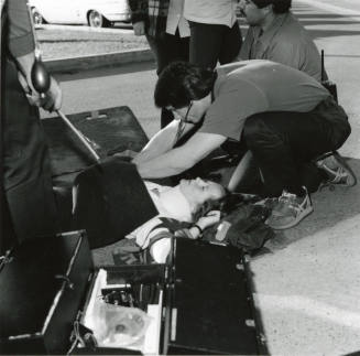Paramedics assisting a female (2 of 3)