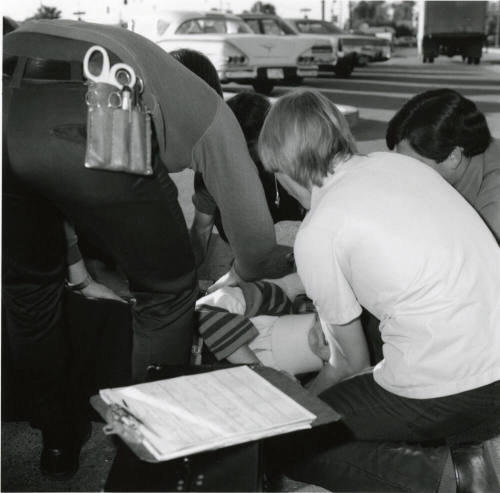 Paramedics assisting a female victim (3 of 3)