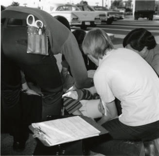 Paramedics assisting a female victim (3 of 3)