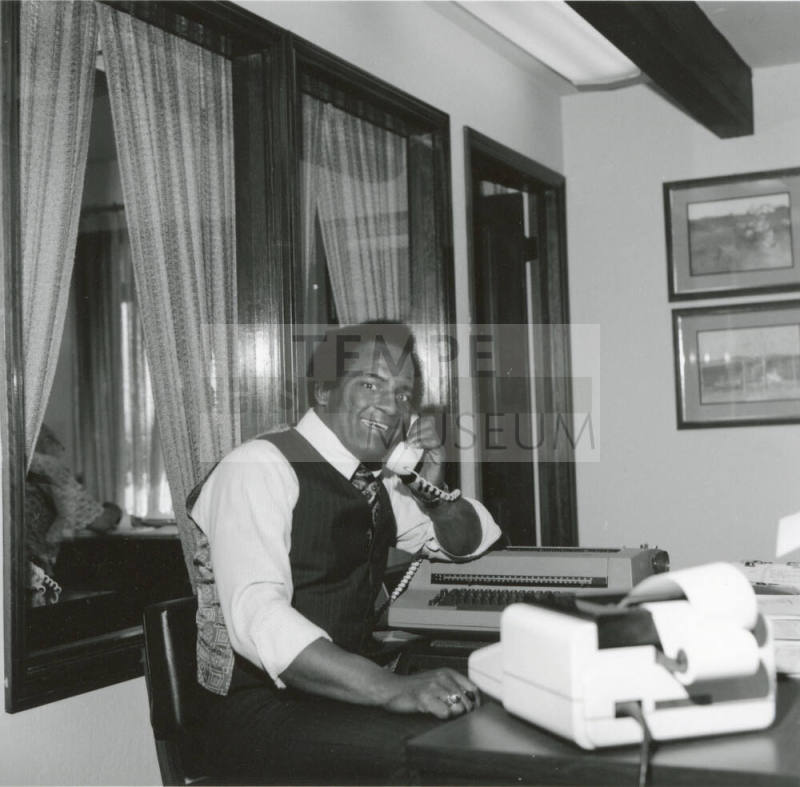 Prentice Williams Sitting at a Desk