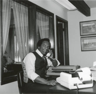 Prentice Williams Sitting at a Desk