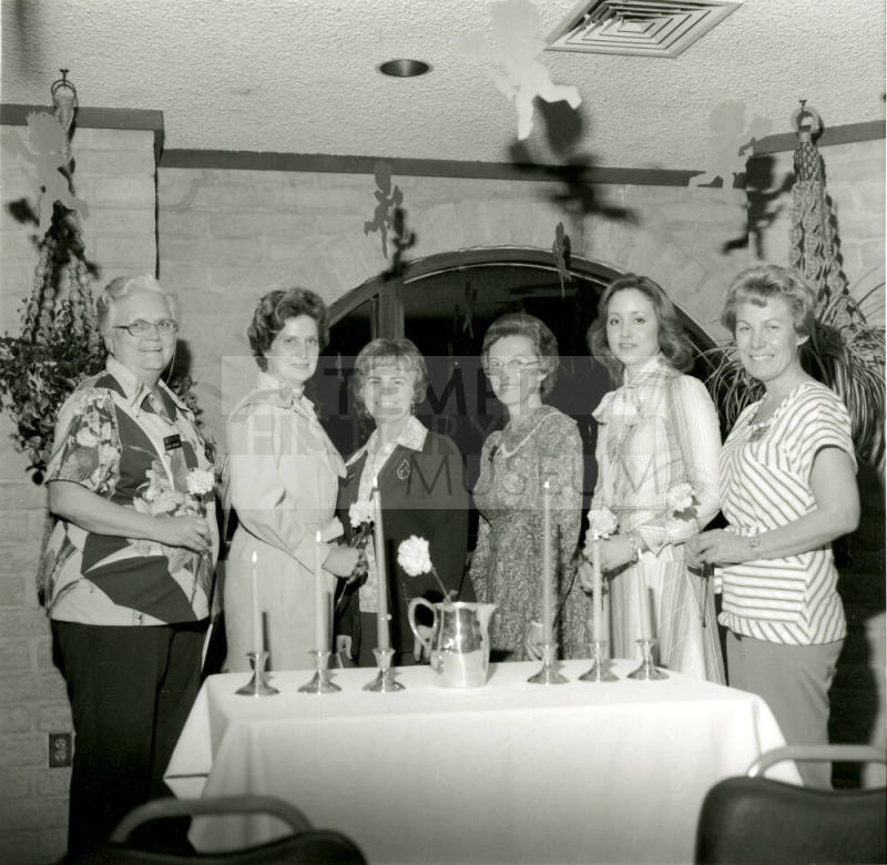 Unidentified Group of Women Around Candled Table