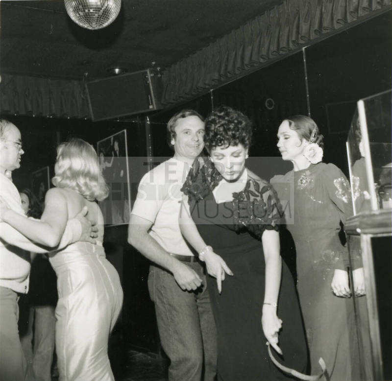 Harry Mitchell dancing Under A Disco Ball
