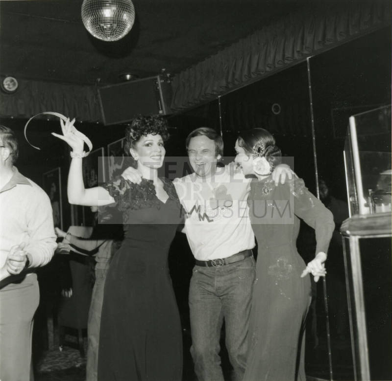 Harry Mitchell posing Under A Disco Ball