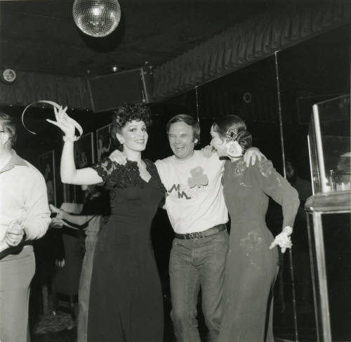 Harry Mitchell posing Under A Disco Ball