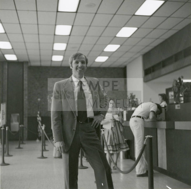 Unidentified Man Standing In Bank or Credit Union (1 of 2)
