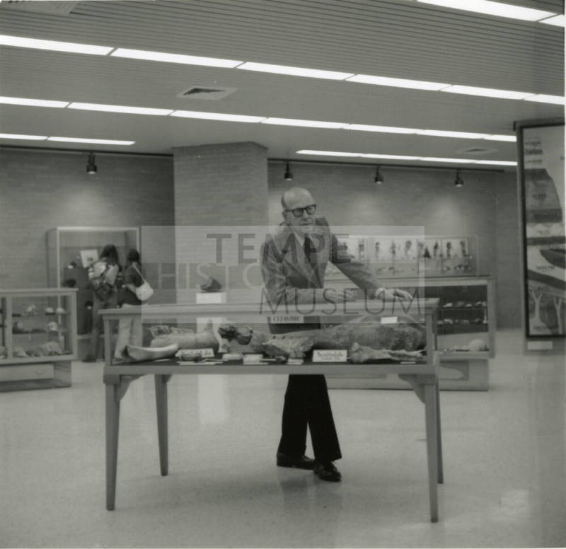 Professor with display case -- May 1978