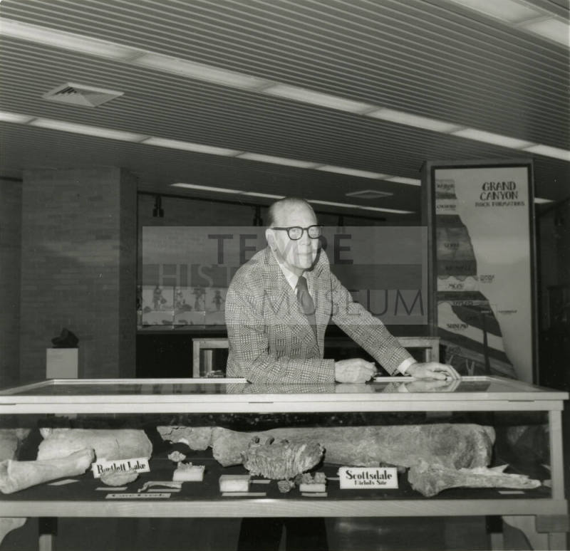 Professor with display case -- May 1978