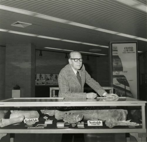 Professor with display case -- May 1978