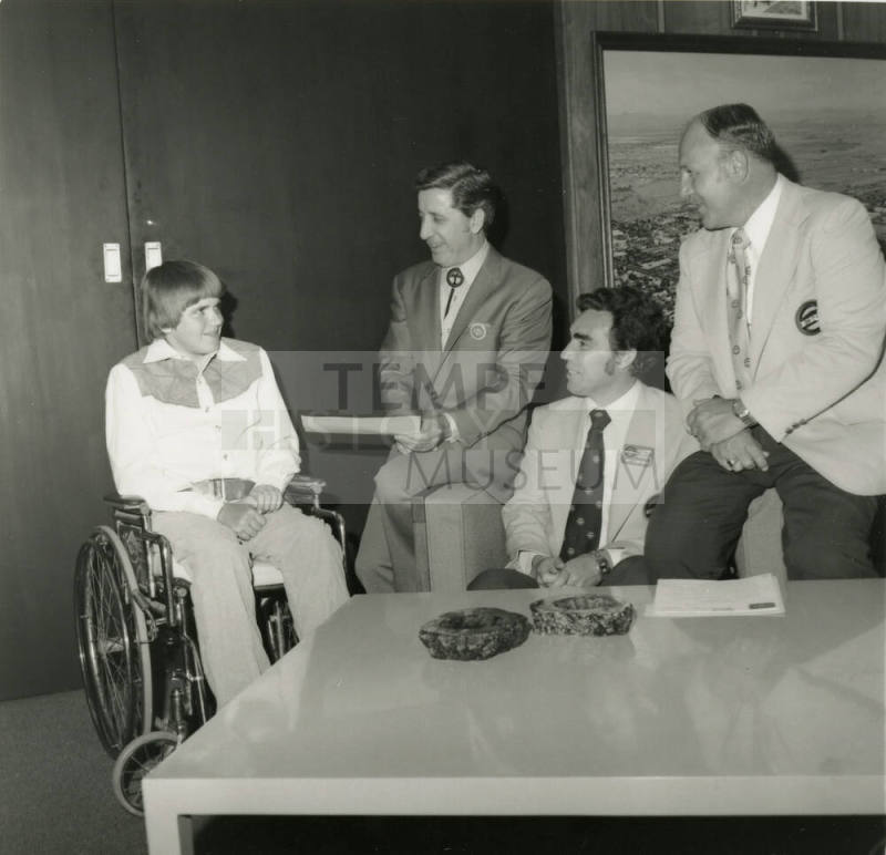 Young man in wheelchair with mayor and others -- April 1978