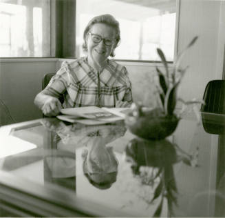Woman at table -- April 1978