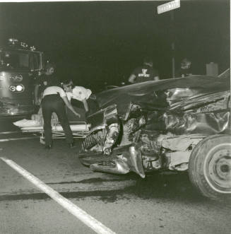 Car Accident, Paramedics Helping a Victim