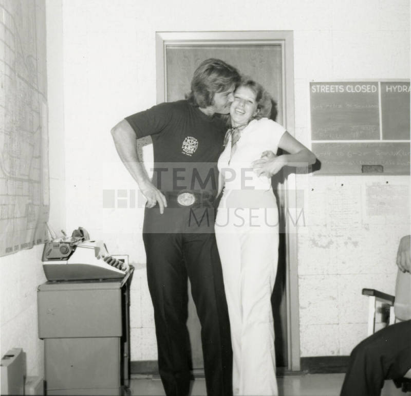 Firefighter Kisses Woman