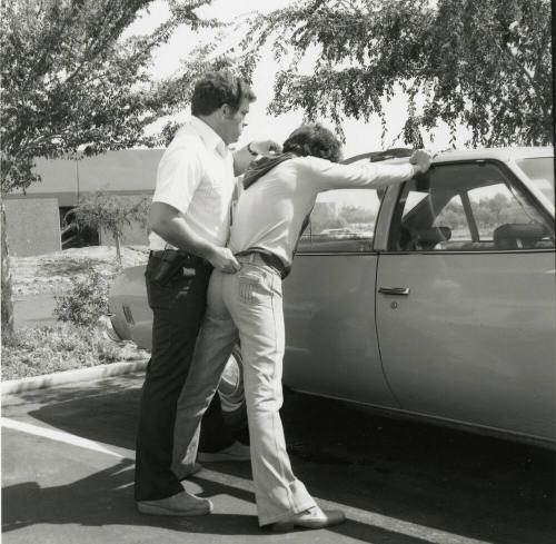Police Officer Holds Man 2