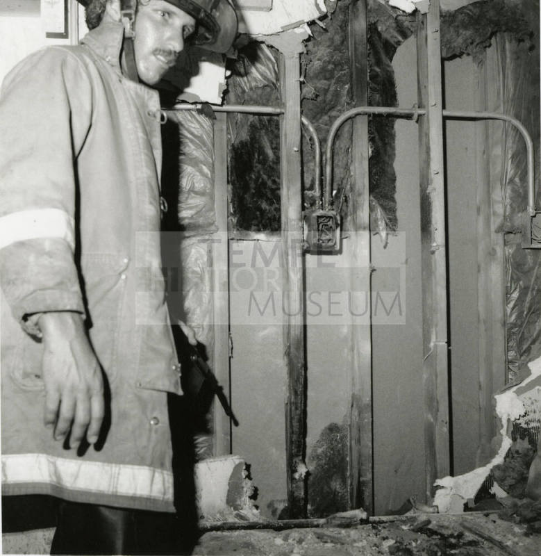 Unidentified Fireman In Burned Room