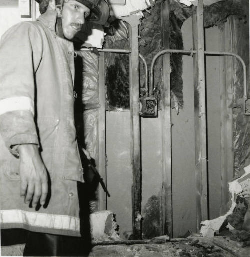 Unidentified Fireman In Burned Room