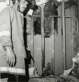 Unidentified Fireman In Burned Room