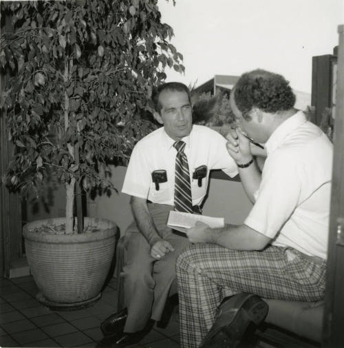 Unidentified Pair of Seated Men Conversing - (1 of 2)