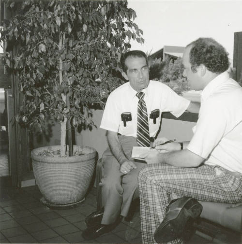 Unidentified Pair of Seated Men Conversing - (2 of 2)