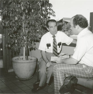 Unidentified Pair of Seated Men Conversing - (2 of 2)