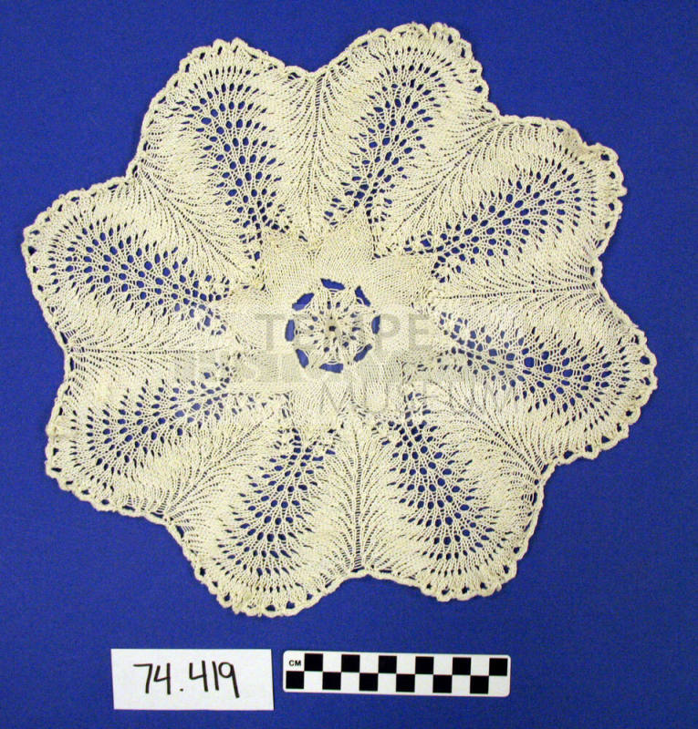 round scalloped crocheted doily