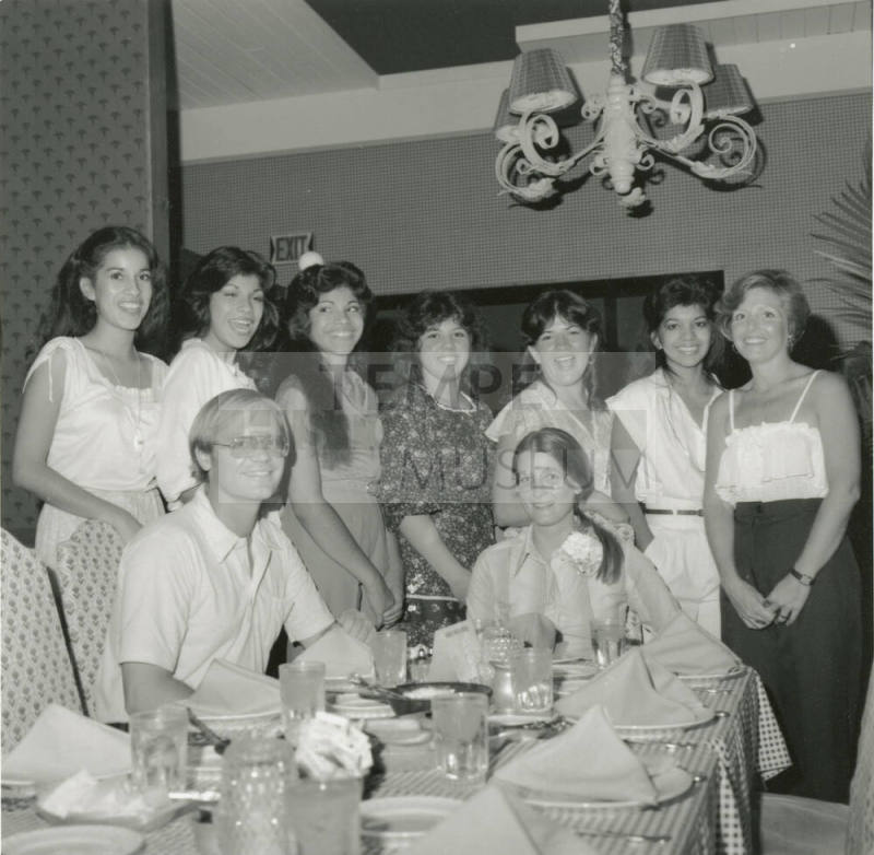 Unidentified Group of 8 Women, 1 Man in Restaurant