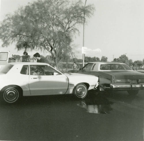 A Man And Woman Exit a White Car - September 1978