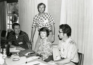 Four unidentified men.