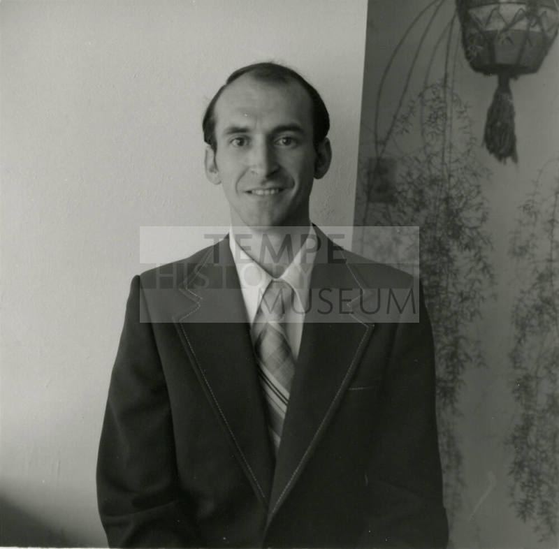 Unidentified Man in Dark Suit and Tie