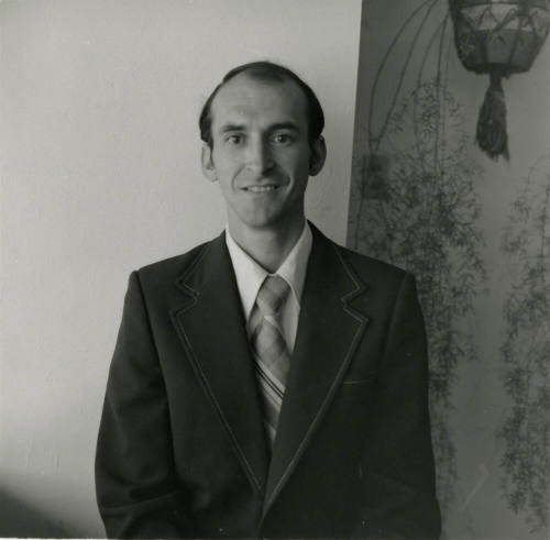 Unidentified Man in Dark Suit and Tie